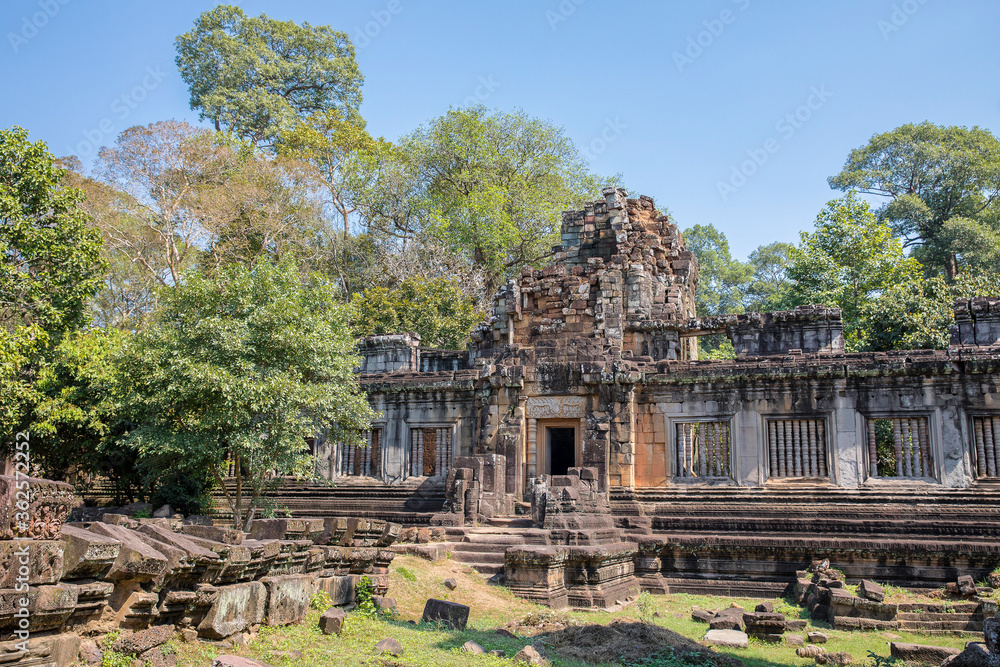 Ancient Preah Palilay temple in Angkor Thom and huge Banyan trees, Angkor, Cambodia.