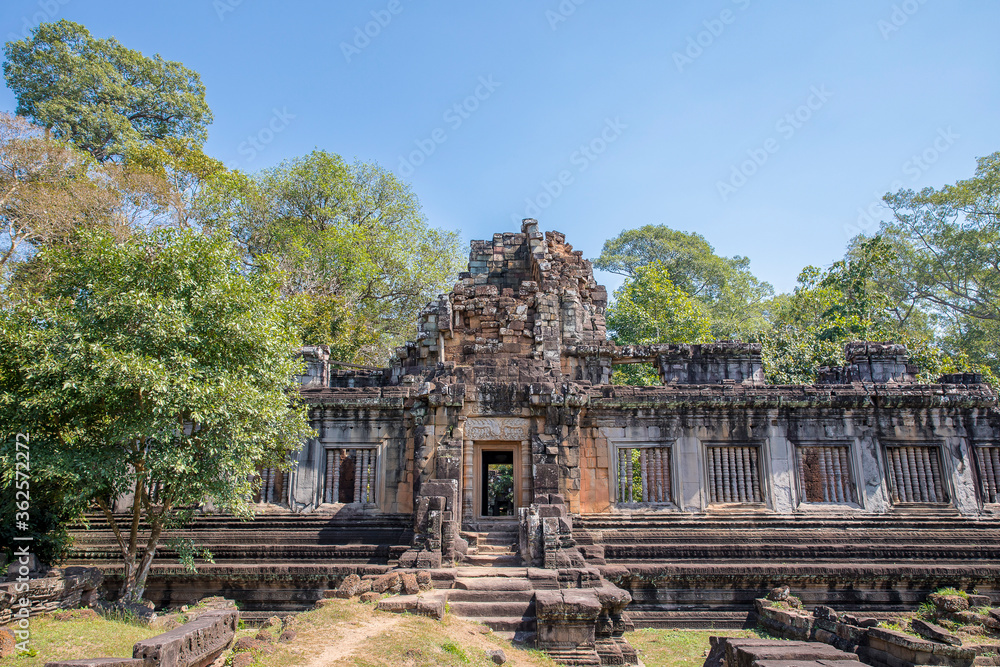 Ancient Preah Palilay temple in Angkor Thom and huge Banyan trees, Angkor, Cambodia.