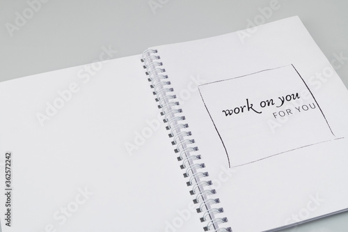 open notepad with markup on a white background