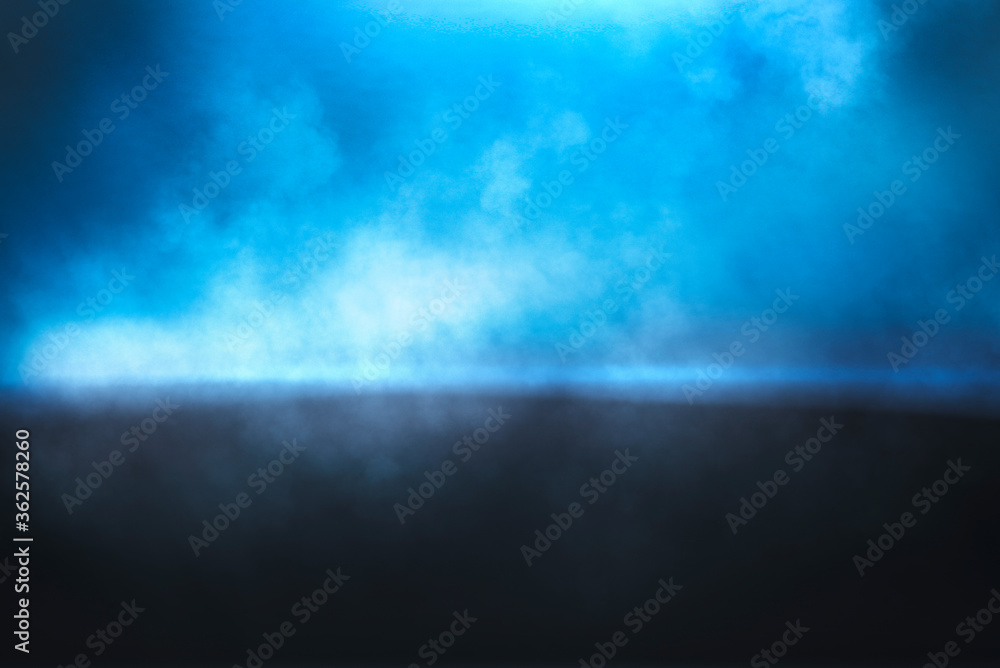 Abstract smoke texture over blue background.