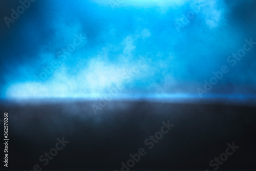 Abstract smoke texture over blue background.