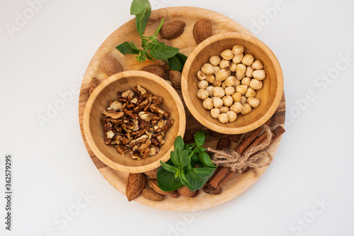 various nuts on a wooden plate