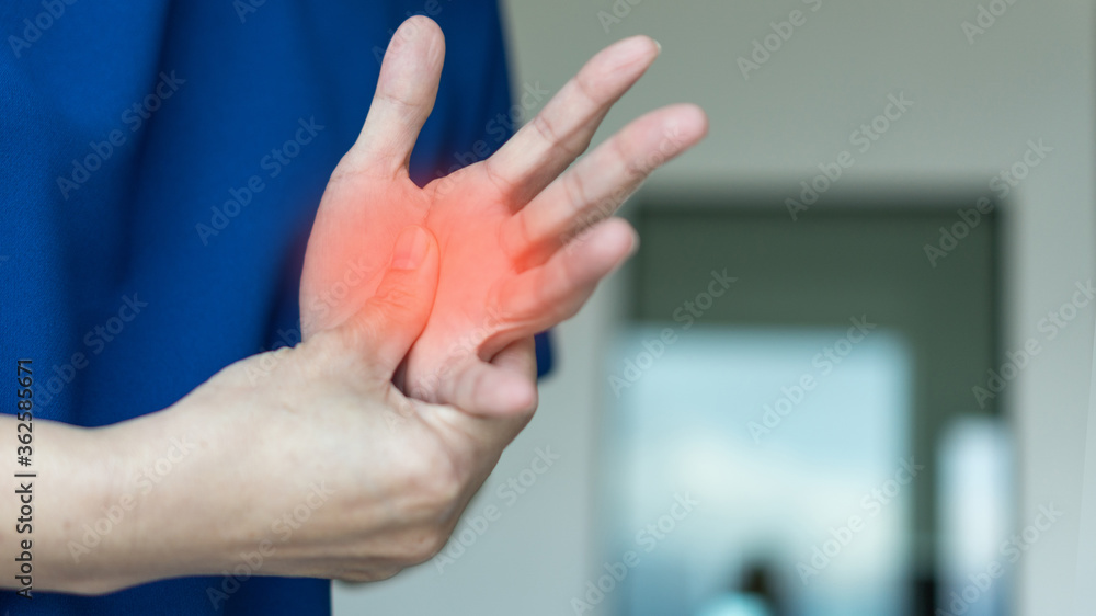 Trigger Finger problems. Woman’s hand with red spot o fingers as suffer ...