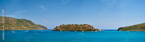 Fototapeta Naklejka Na Ścianę i Meble -  Panorama of Island of Spinalonga with old fortress former leper colony and the bay of Elounda, Crete island, Greece