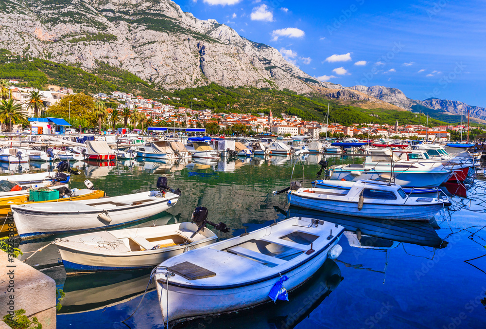 Croatia summer holidays - Famous Adriatic coast - Makarska riviera in Dalmatia. Charming marine with fishing boats.