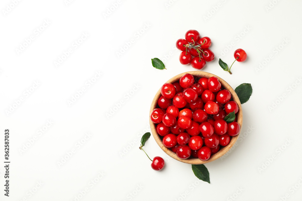 Bowl with fresh red cherry on white background, top view Bowl with fresh red cherry on white background, top view