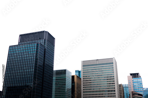 Tokyo glass modern building against bright sky. © HafizMustapha