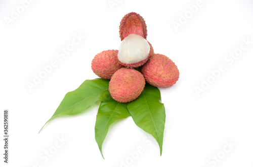 red ripe lychee with green leaves isolated on white background.