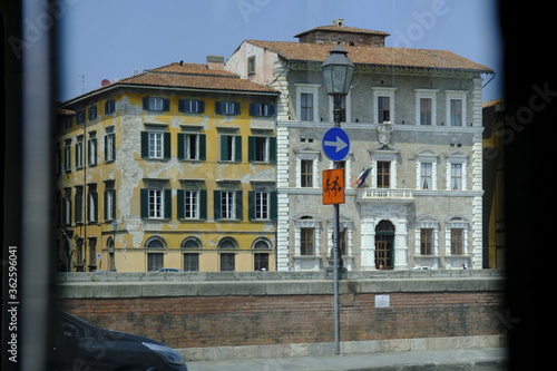 Reflection of old houses in Pisa