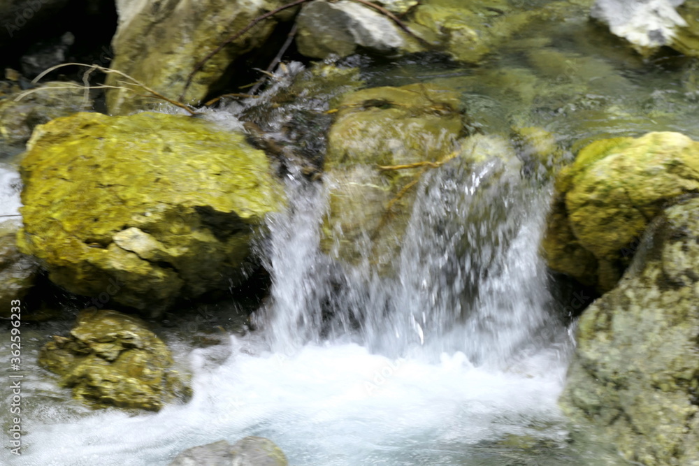 water flowing over rocks water flowing over rocks