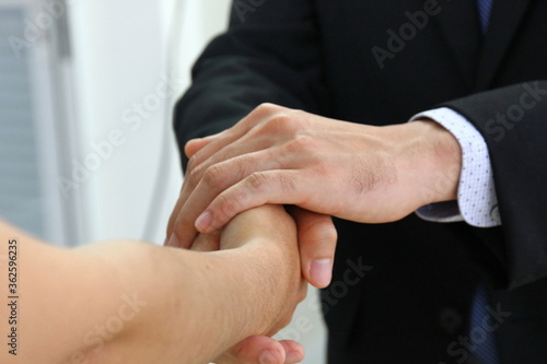 close up business man handshake with new partner. the manager handshake with the new worker to join in work