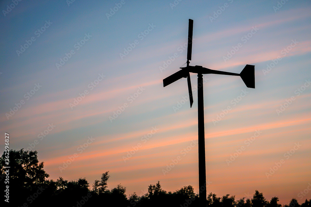 Obraz premium silhouette of windmill with sunset