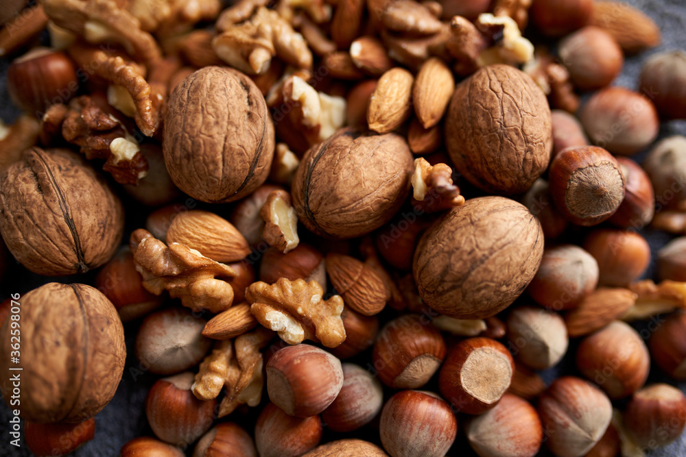 Mix of different nuts, background wiith walnuts, almonds and hazenuts Mix of different nuts, background wiith walnuts, almonds and hazenuts