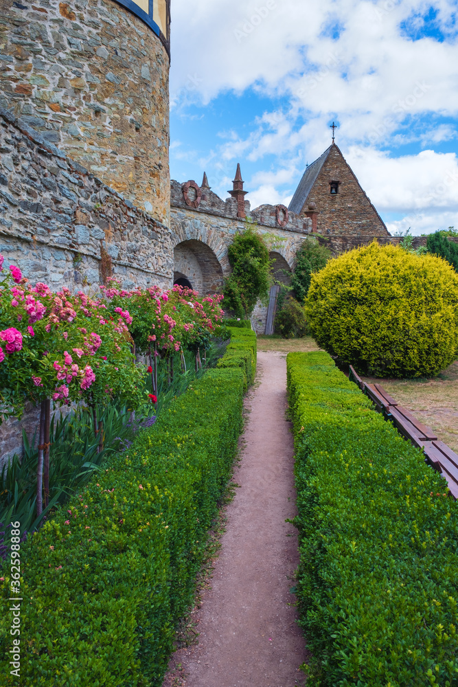 A path lined with hedges