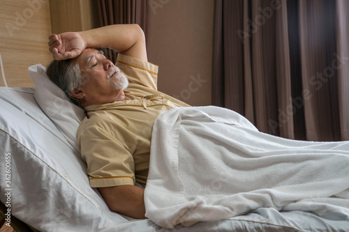 Elderly male patients lie in bed, worried patients, illness in nursing home