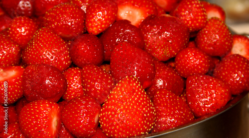 Lots of fresh strawberries. Peeled strawberry fruit.