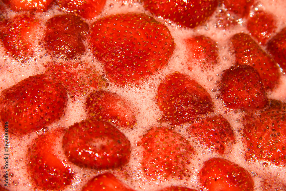 Strawberry jam is being made. A seething mass with berries. Strawberry jam is being made. A seething mass with berries.