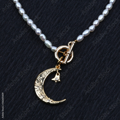 Golden crescent moon pendant with pearl necklace