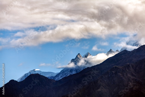 Fototapeta Naklejka Na Ścianę i Meble -  View of Panchachauli peaks of the Great Himalayas as seen from Munsiyari, Uttarakhand, India.