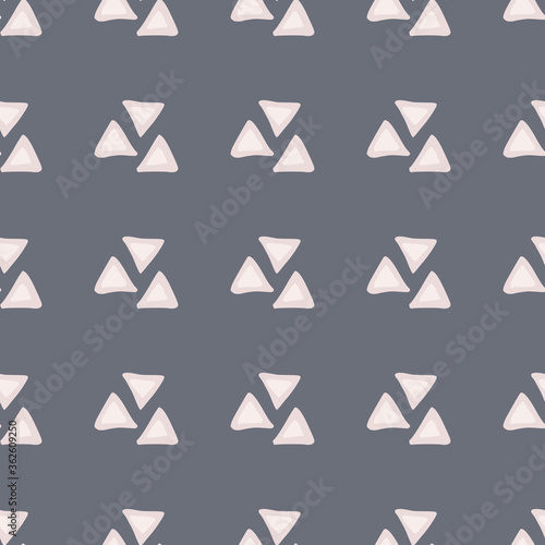 Geometric seamless pattern with light pink triangles. Dark blue background.