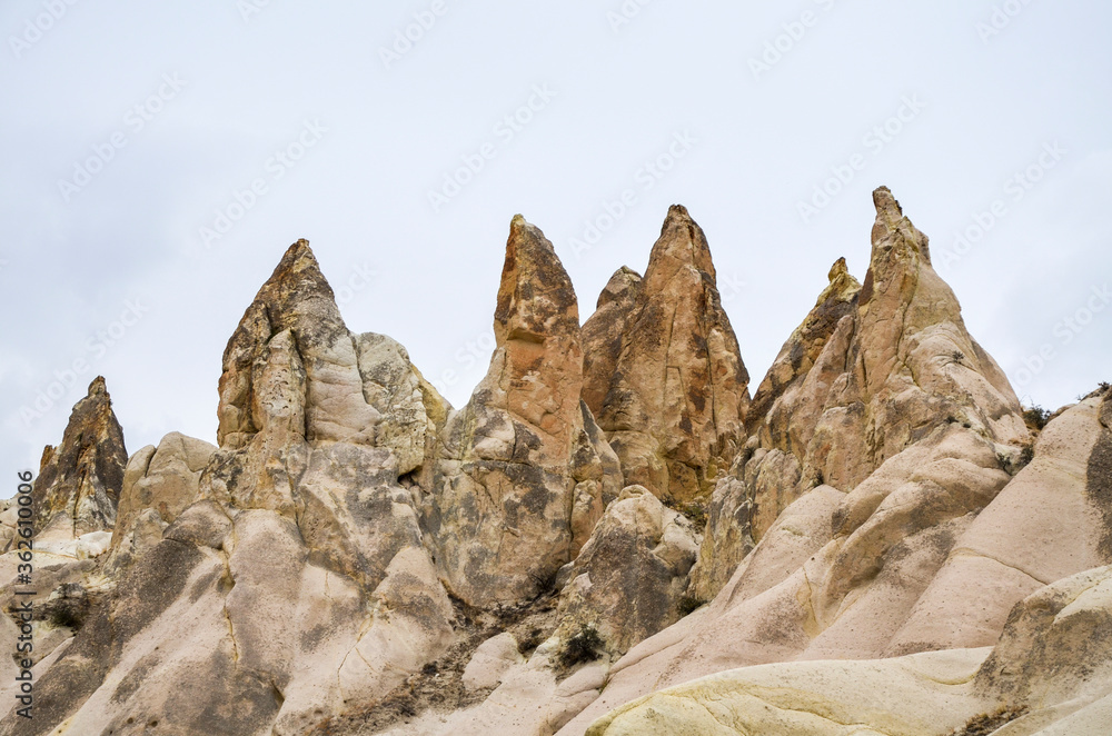 Photo of beautiful unique Mountain landscape with fairy chimneys in Goreme, Cappadocia, Turkey