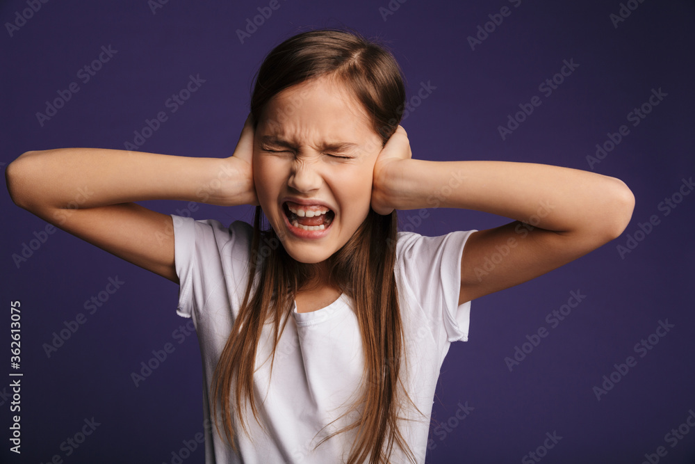 Photo of annoyed beautiful girl screaming and covering her ears Photo of annoyed beautiful girl screaming and covering her ears