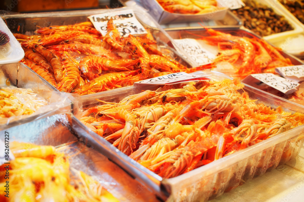 Pile of shrimps on fish market, toned