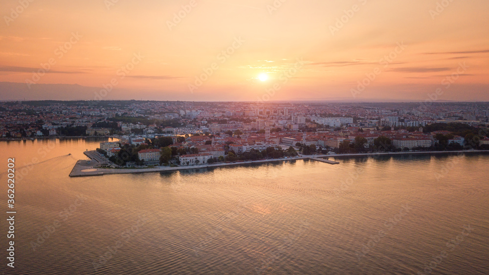 Aerial view of Zadar old city, amazing sunrise cityscape, Dalmatia, Croatia. Famous tourist resort on Adriatic sea coast, outdoor travel colorful background with rising sun