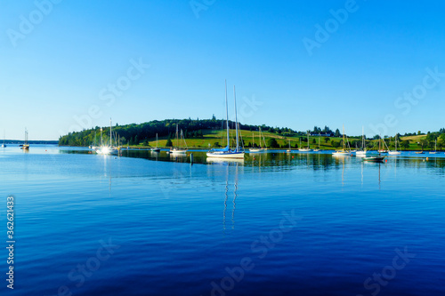 Boats and a green hill in Lunenburg Harbor photo