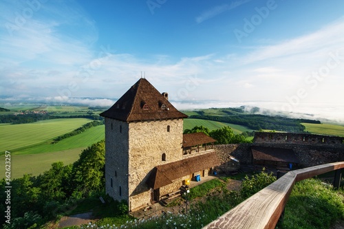 View of the fog in the valley from the castle ruins. In the morning.Stary Jicin. Moravia.