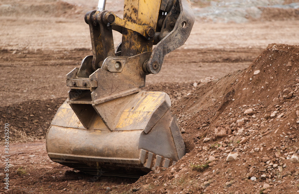 Excavator bucket operating at construction site