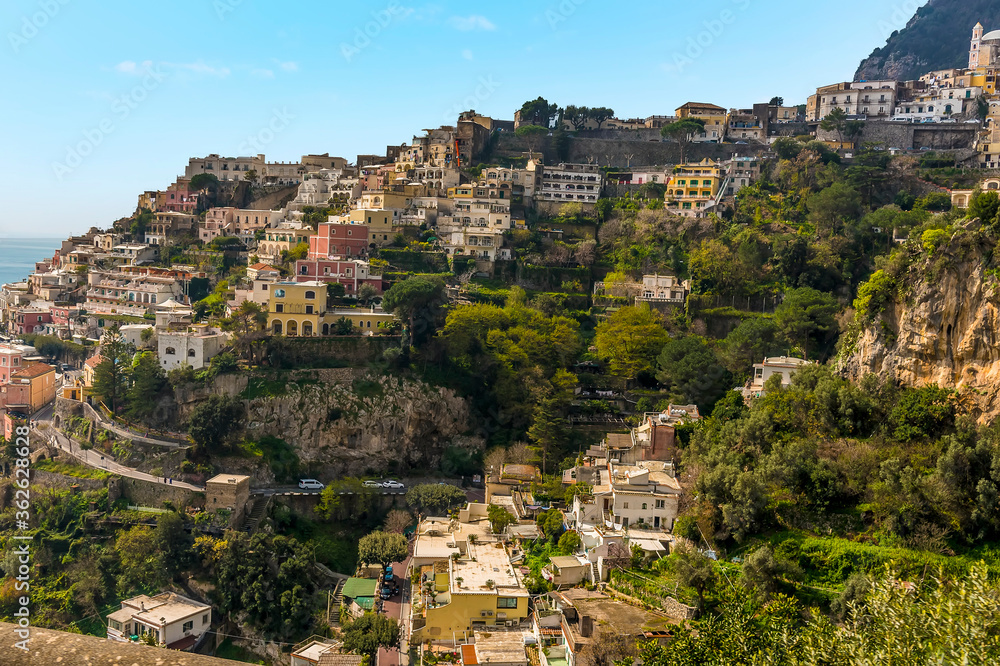 Pastel coloured buildings dot the hillside in Positano on the Amalfi coast, Italy