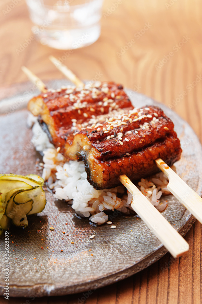 Fotografie Fried unagi eel with barbecue sauce, toned