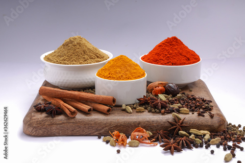 Spices with wooden background photo