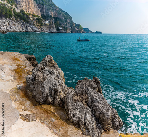 Rocks incorporated into the bathing platform at Marina di Praia, Praiano, Italy photo