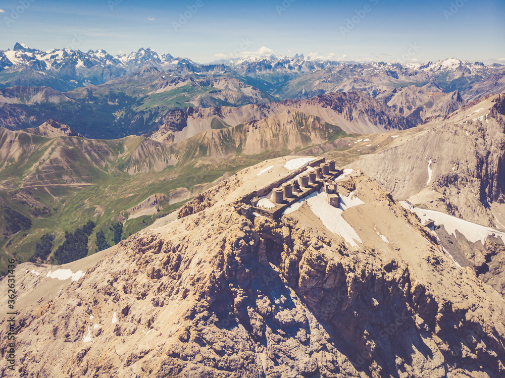 Mount Chaberton aerial view from airplane, peak of mountain in the Cottian Alps located in the French department of the Hautes-Alpes with forts battery on the top. 