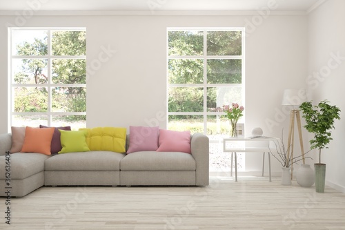 Wallpaper Mural White living room with sofa and summer landscape in window. Scandinavian interior design. 3D illustration Torontodigital.ca