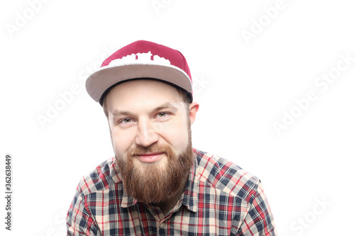 Happy caucasian bearded man in checkered shirt and in red cap isolated on white background