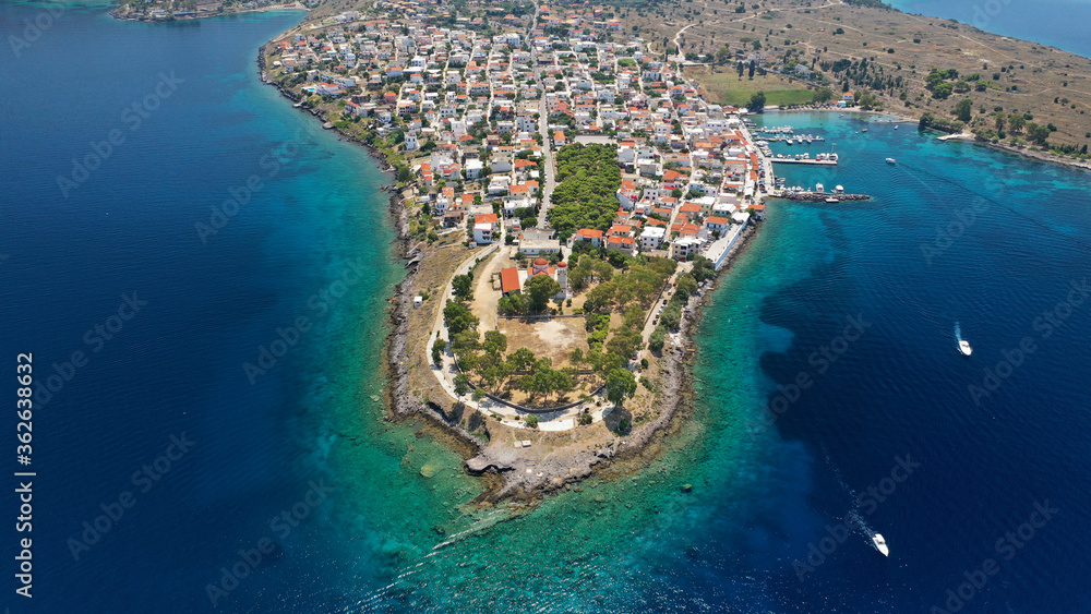 Aerial drone photo of picturesque fishing village of Perdika next to iconic small island of Moni, Aigina island, Saronic gulf, Greece