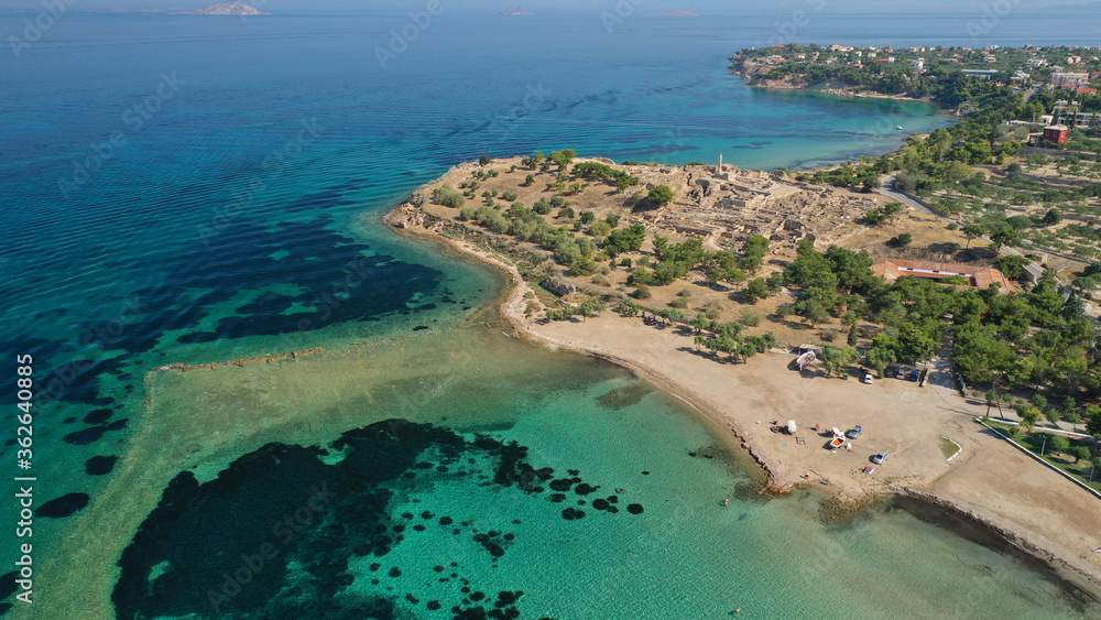 Aerial drone photo of archaeological site of Temple of Apollo and ancient port next to main port of Aigina island, Saronic gulf, Greece