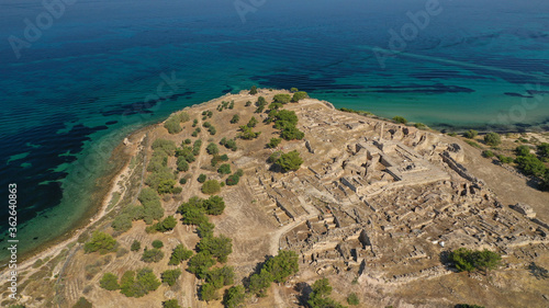 Aerial drone photo of archaeological site of Temple of Apollo and ancient port next to main port of Aigina island, Saronic gulf, Greece photo