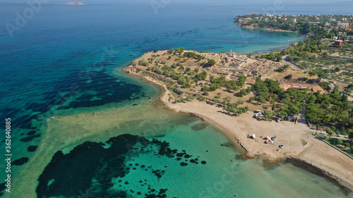 Aerial drone photo of archaeological site of Temple of Apollo and ancient port next to main port of Aigina island, Saronic gulf, Greece