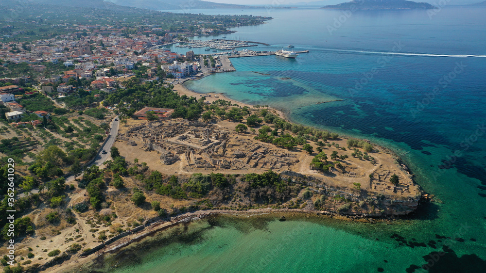 Aerial drone photo of archaeological site of Temple of Apollo and ancient port next to main port of Aigina island, Saronic gulf, Greece