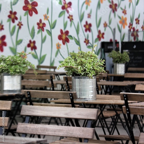 garden table with flowers in café