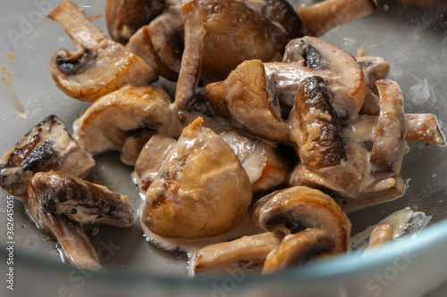 Fried champignons mushrooms close-up. Pizza filling