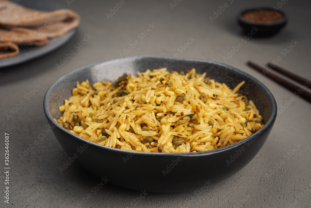 Kichari in a gray dish on a concrete surface Kichari in a gray dish on a concrete surface