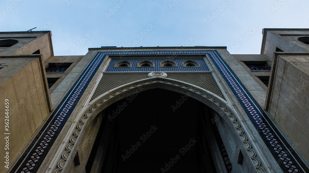 classic symmetrical arab architecture building with mosaic in Dubai, UAE