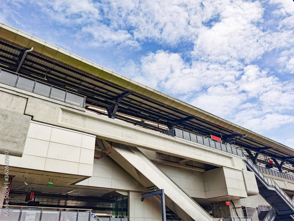 Architecture construction of elevator, escalator stairs and sky walk way, walk bridge between sky train station and department store mall Architecture construction of elevator, escalator stairs and sky walk way, walk bridge between sky train station and department store mall