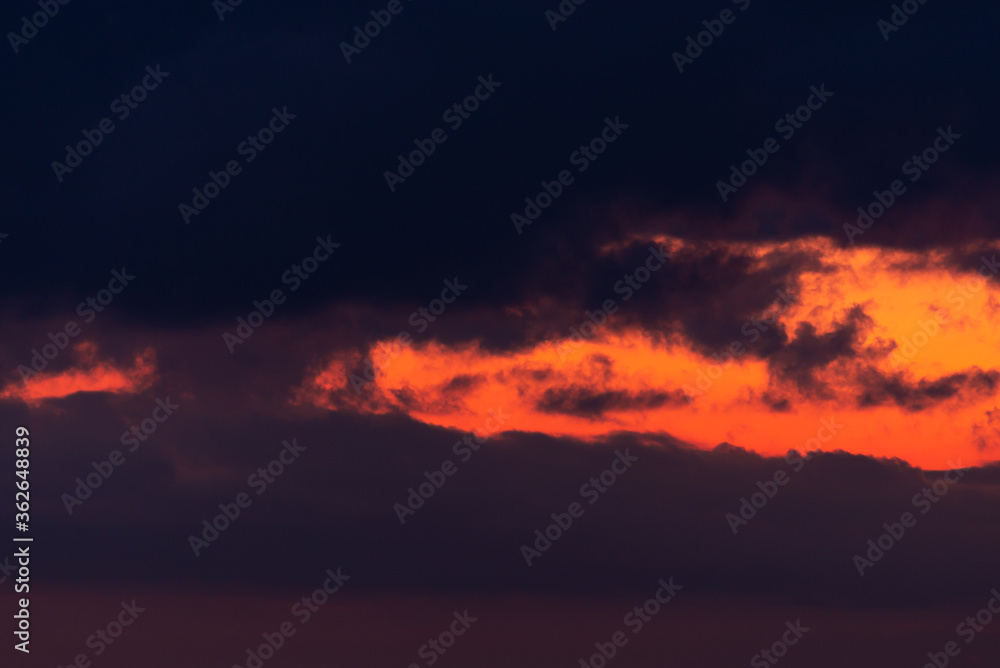 Pink clouds close up at sunset in the evening