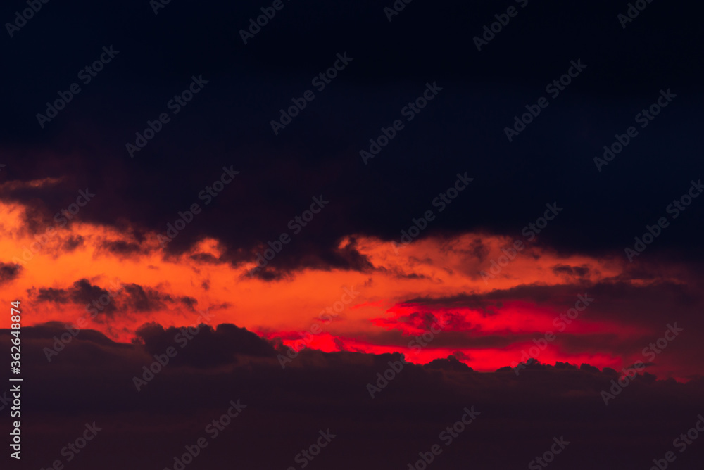 Pink clouds close up at sunset in the evening